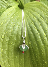 Load image into Gallery viewer, Silver petaled opaque green flower necklace, with small pearl and tiny red bead, on raindrop leaf. On a dainty silver ball chain.
