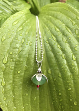 Load image into Gallery viewer, Silver petaled opaque green flower necklace, with small pearl and tiny red bead, on raindrop leaf. On a dainty silver ball chain.